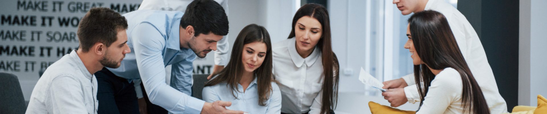 guy-shows-document-girl-group-young-freelancers-office-have-conversation-working (1)